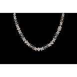 A DIAMOND NECKLACE BY TIFFANY & CO, set throughout with round and step cut diamonds of approx. 10.