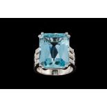 AN AQUAMARINE AND DIAMOND DRESS RING, one rectangular step cut aquamarine of approx 15.