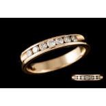 A DIAMOND HALF ETERNITY RING, of approx. 0.