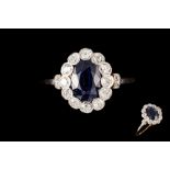 A SAPPHIRE AND DIAMOND OVAL CLUSTER RING, with one oval cut sapphire of 1.