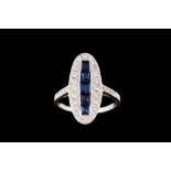 A SAPPHIRE AND DIAMOND OVAL FINGERLINE RING