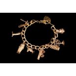 A GOLD CHARM BRACELET, 41.9gms