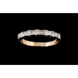 A DIAMOND HALF ETERNITY RING,