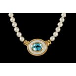 A CULTURED PEARL NECKLACE, with topaz, diamond and mother of pearl pendant,