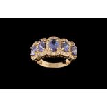 A SAPPHIRE AND DIAMOND CLUSTER RING,