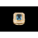 A BLUE TOPAZ AND DIAMOND CLUSTER RING,
