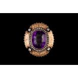 AN AMETHYST AND DIAMOND SHIELD BROOCH,