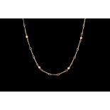 A 9CT YELLOW GOLD FETTER AND BEAD LINK NECKCHAIN