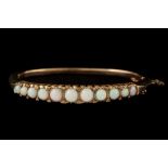 AN OPAL AND DIAMOND SET BANGLE,