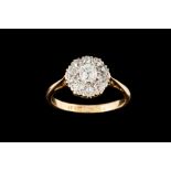 AN EDWARDIAN DIAMOND CLUSTER RING, with diamonds of approx 0.85ct in total, mounted in 18ct gold.