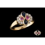 A PINK AND BLUE SAPPHIRE AND DIAMOND CLUSTER RING, mounted on 18ct gold,