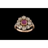 AN EARLY VICTORIAN RUBY AND DIAMOND CLUSTER RING