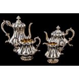 A VICTORIAN SILVER FOUR PIECE SILVER TEA AND COFFEE SERVICE, with chaised and engraved decorations,