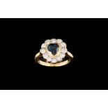 A SAPPHIRE AND DIAMOND HEART SHAPED RING,