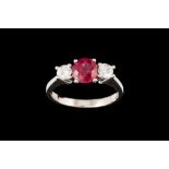 A RUBY AND DIAMOND THREE STONE RING, with ruby of approx. 1.15ct, diamonds of approx. 0.