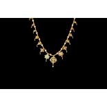 AN INDIAN FINE GOLD NECKLACE, set throughout with turquoise, ruby, sapphire,