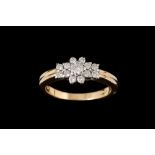 A DIAMOND CLUSTER RING,