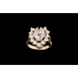 A HEART SHAPED DIAMOND AND PINK SAPPHIRE CLUSTER RING,