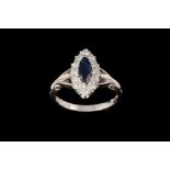 A SAPPHIRE AND DIAMOND NAVETTE SHAPE CLUSTER RING, with one marquise cut sapphire of 0.