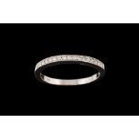 A DIAMOND HALF ETERNITY RING,