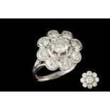 A DIAMOND DAISY CLUSTER RING, with diamonds of approx. 3.