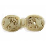 A Chinese celadon jade 'twin geese and lotus' belt buckle