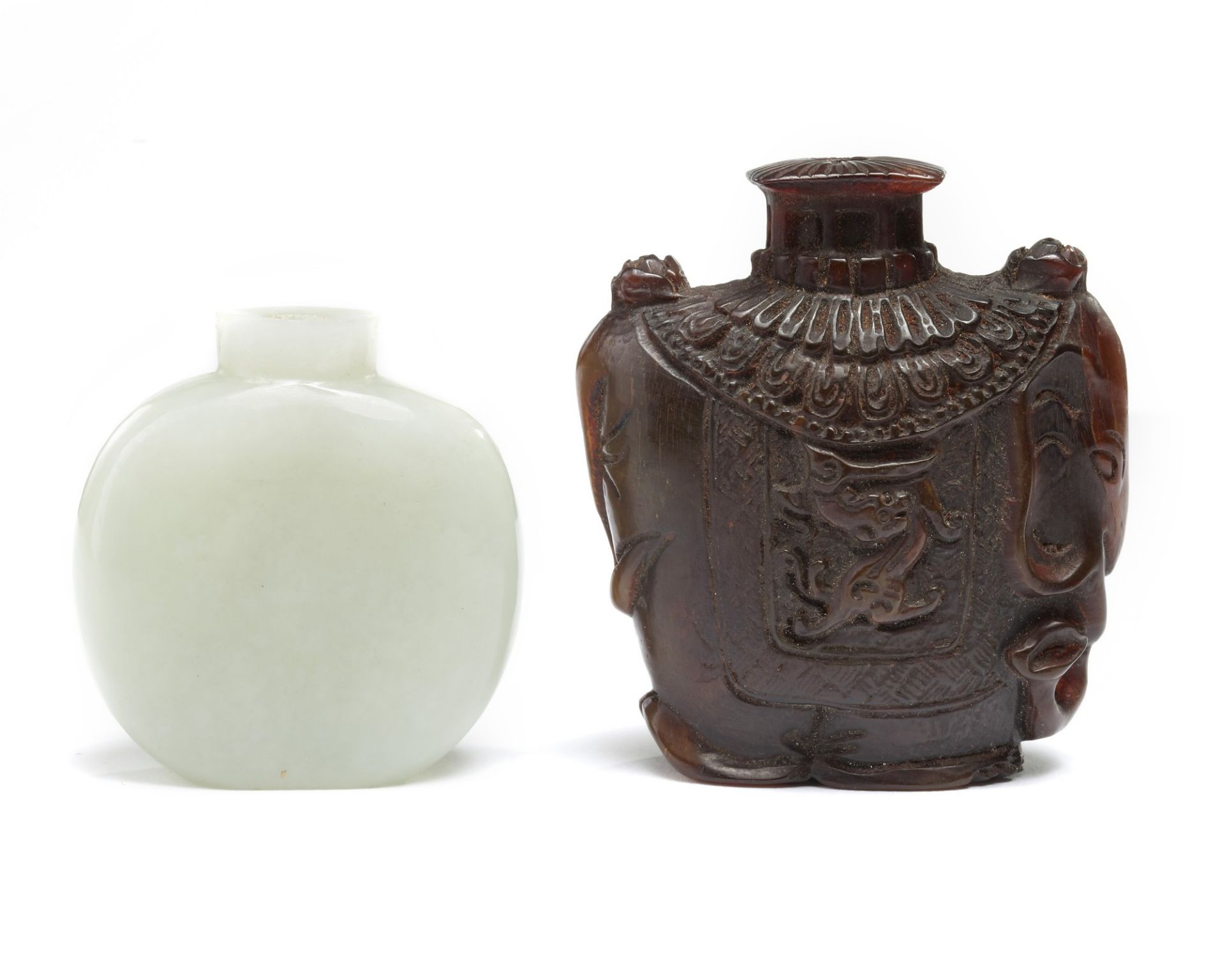 A Chinese pale celadon jade snuff bottle and a buffalo horn snuff bottle