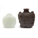 A Chinese pale celadon jade snuff bottle and a buffalo horn snuff bottle