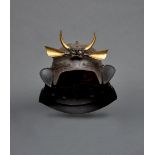 An iron helmet with a plate nailed on top, resembling of the shield of a beetle (henkei kabuto)