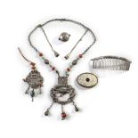 A group of Mongolian silver and metal accessories