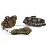 A Mongolian leather flint pocket, a gilt-metal-decorated leather wallet and needle-case