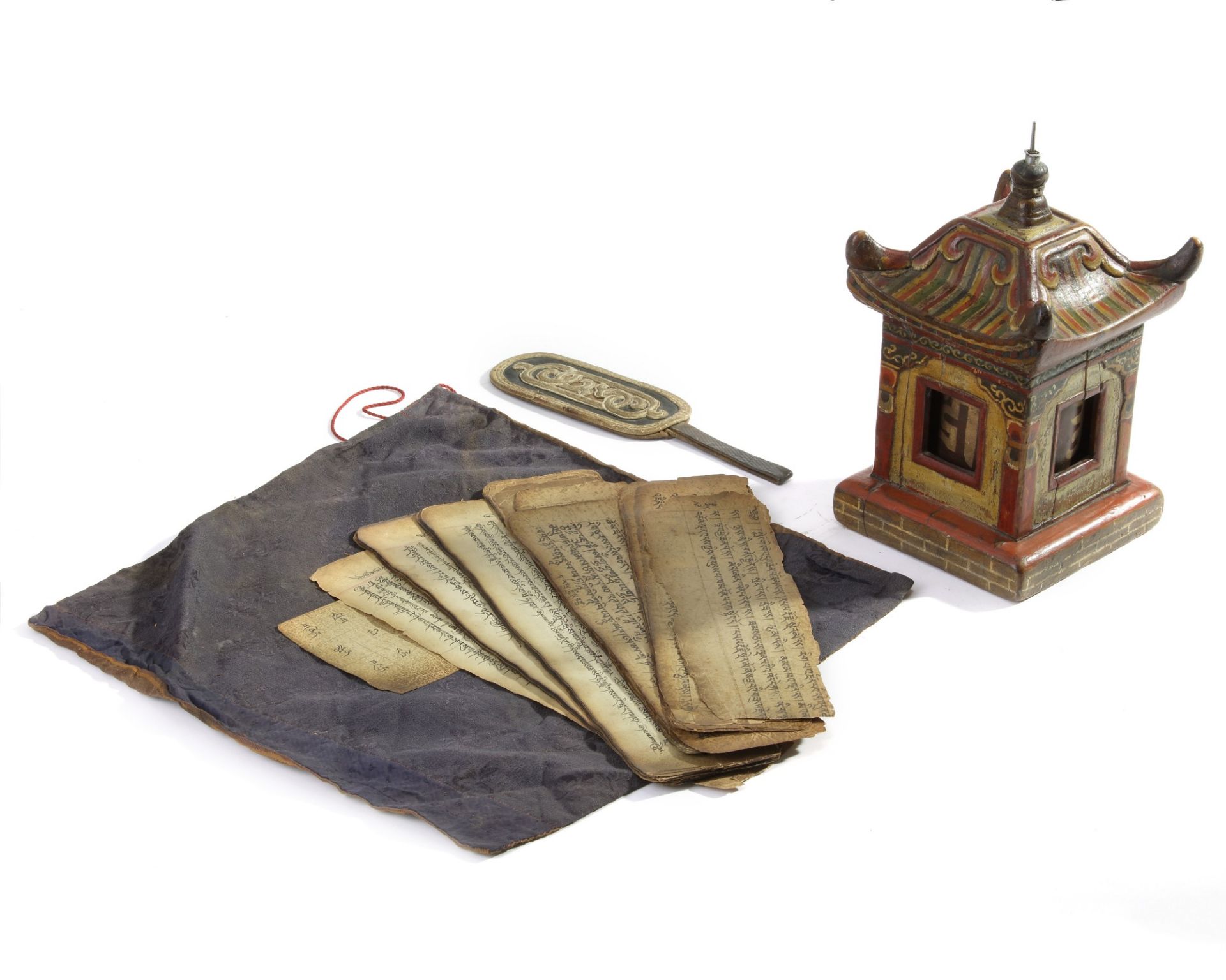 A small Mongolian leather bag, three manuscript sections and a wooden prayer wheel