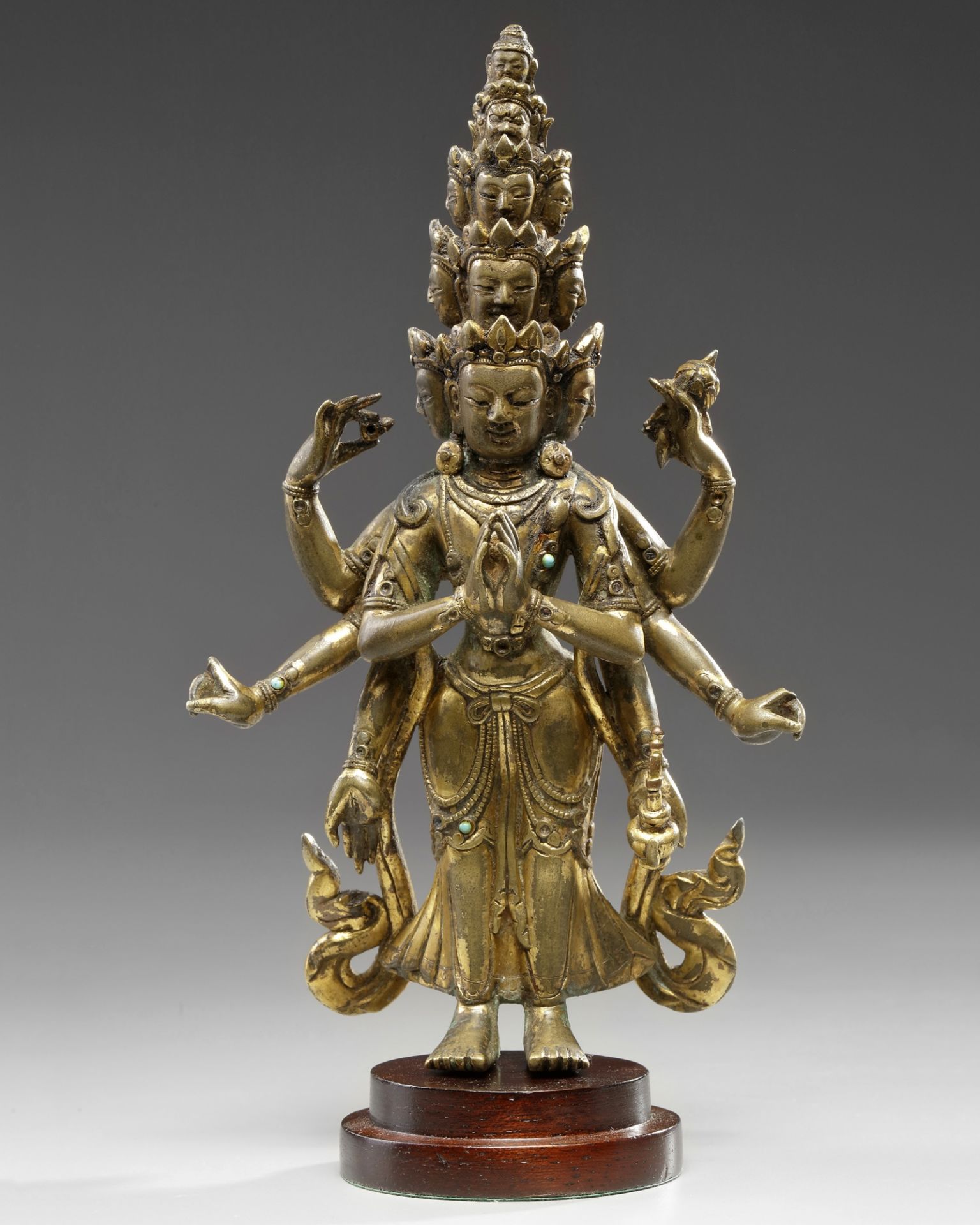 A Sino-Tibetan gilt bronze eleven-headed eight-armed Avalokitesvara