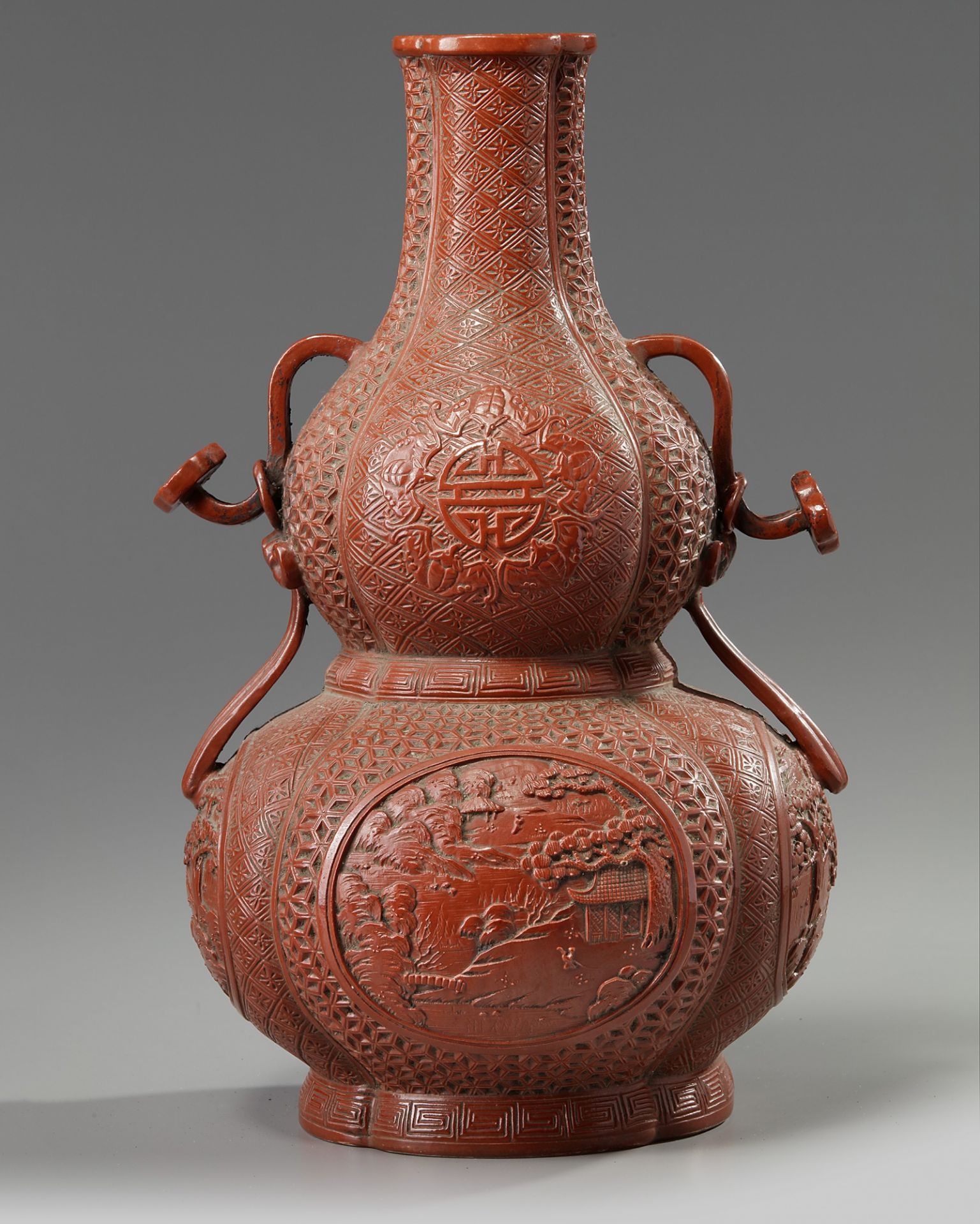A Chinese imitation-cinnabar-lacquer double gourd vase