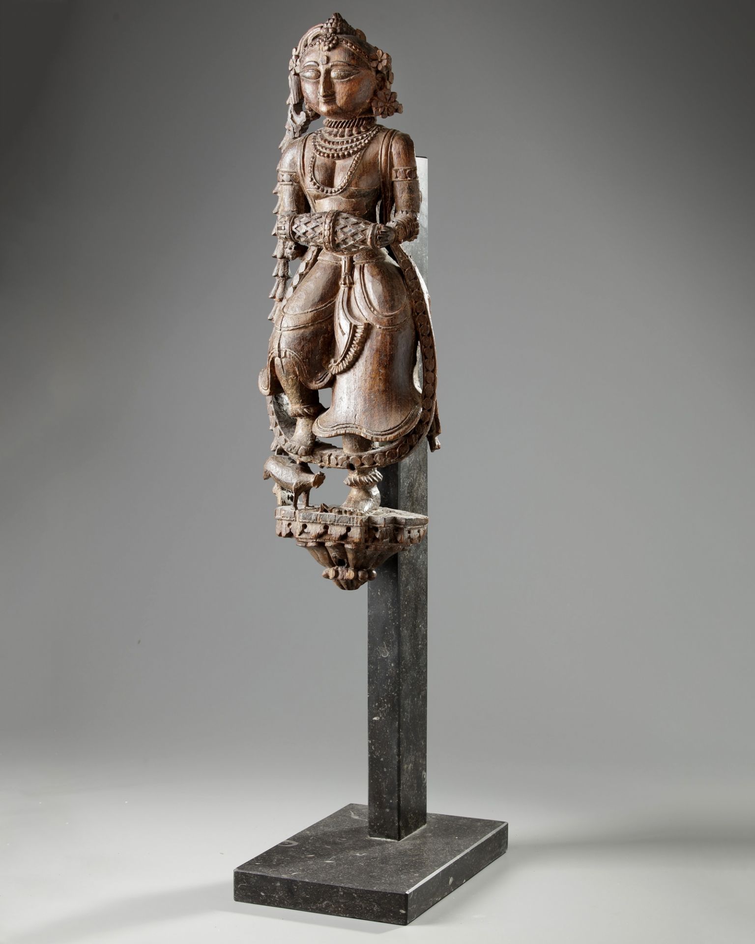 An Indian wood sculpture of a lady on a marble stand - Image 2 of 3