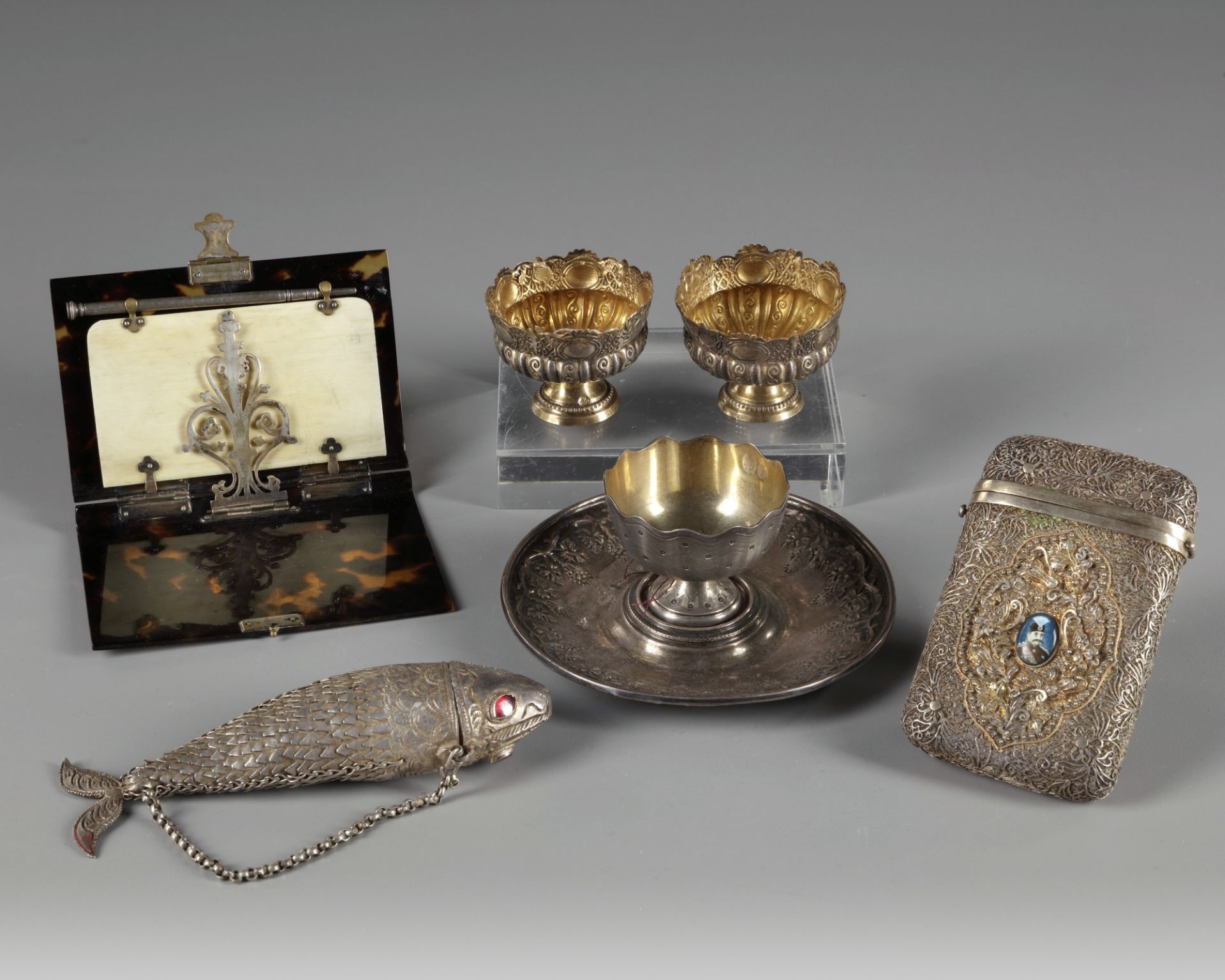Six Islamic silver objects and a tortoise shell card holder