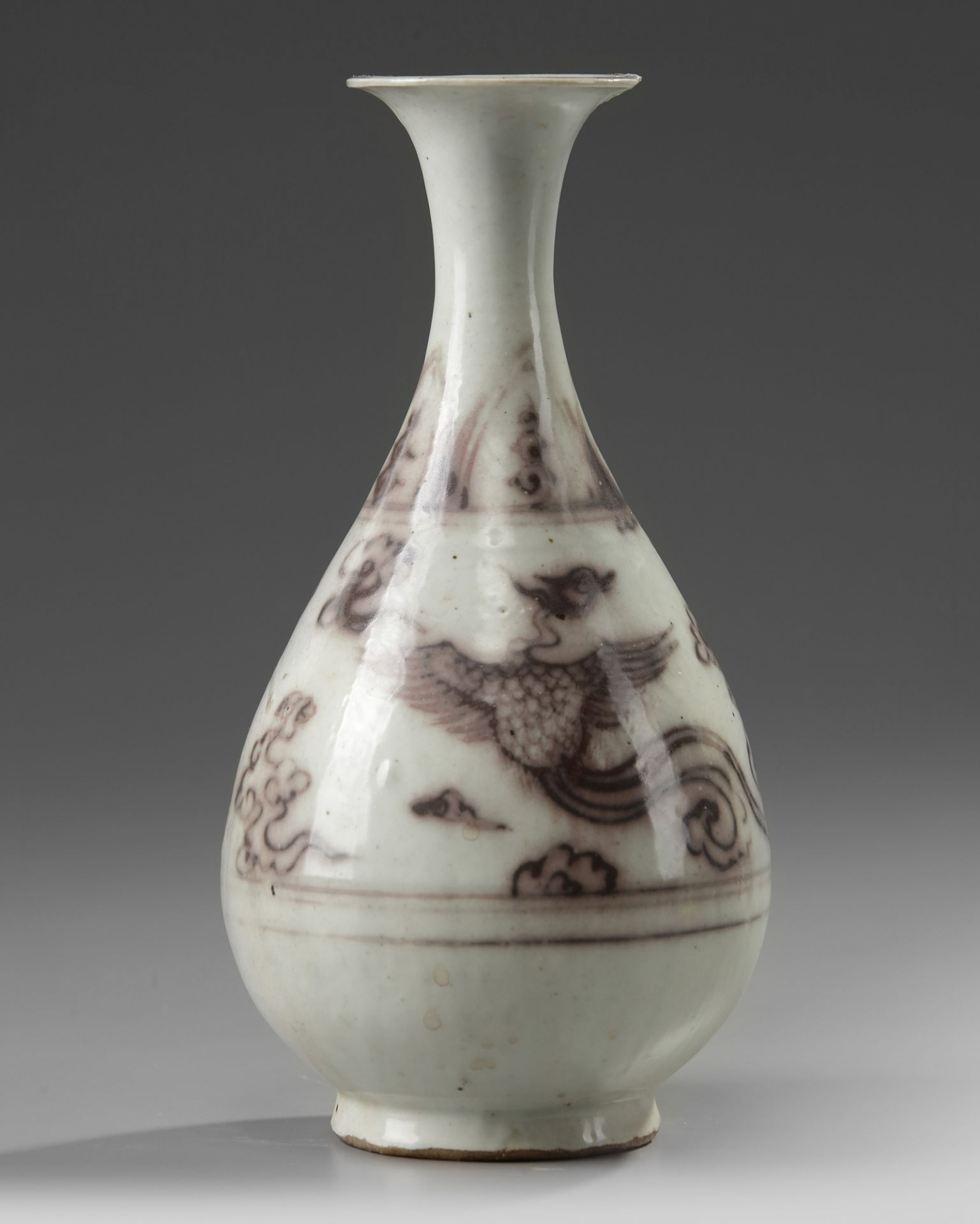 A Chinese Ming-style underglaze copper red 'phoenix' pear-shaped vase, yuhuchunping