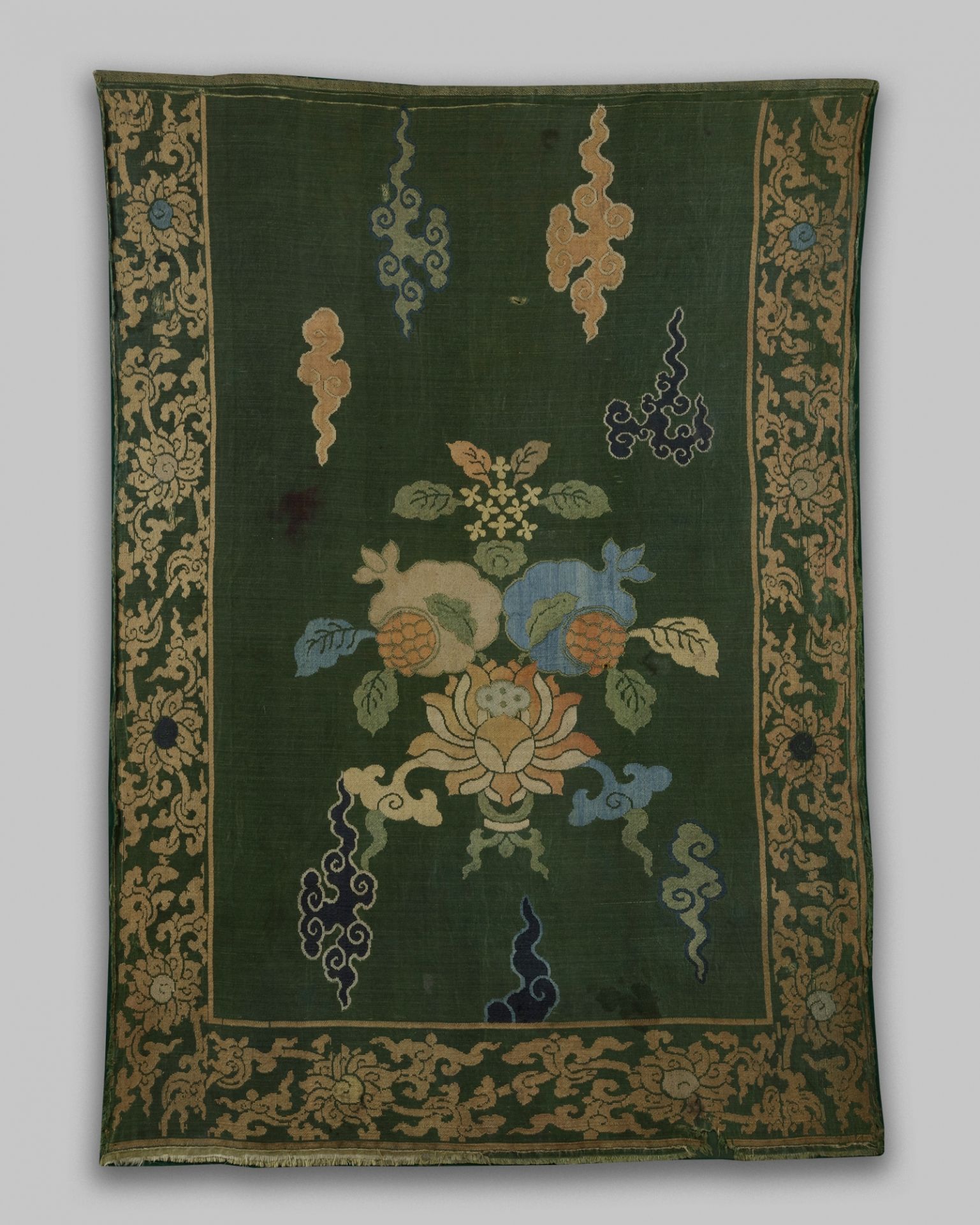 A Chinese green-ground 'lotus and pomegranate' brocade panel