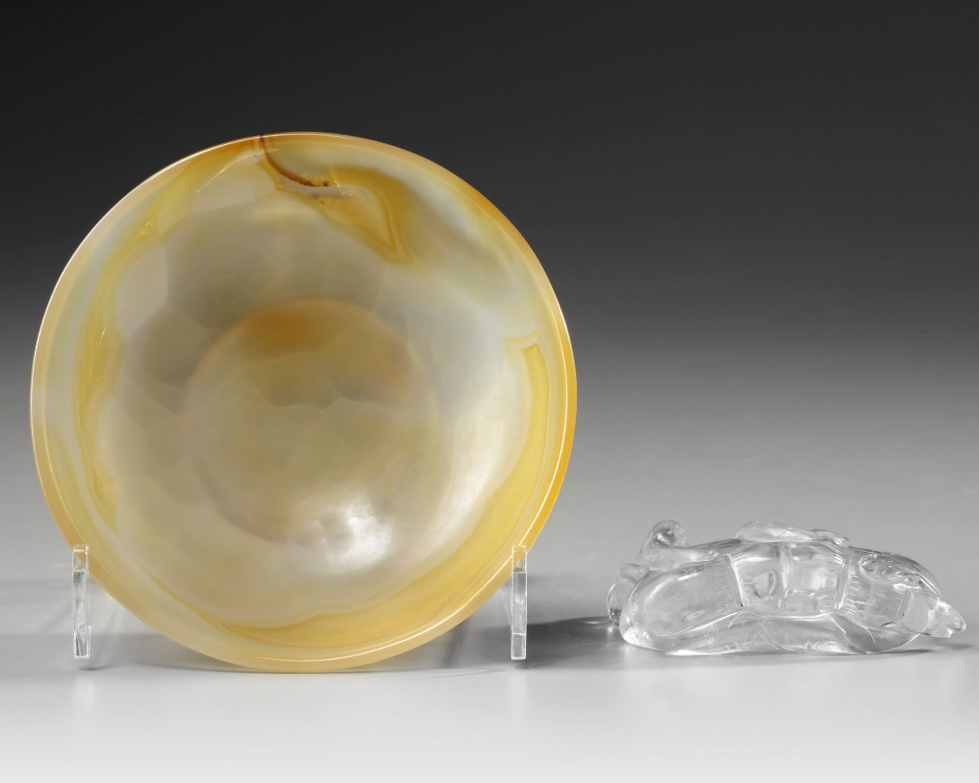 A Chinese rock crystal lotus-form washer and an agate washer