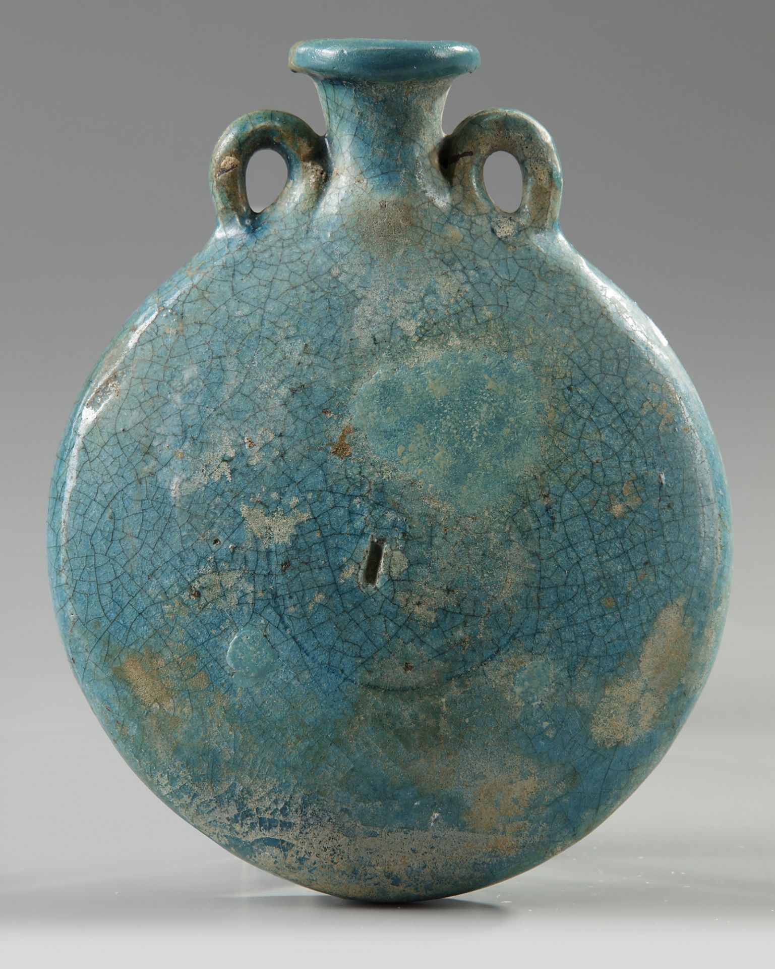 A Islamic Kashan turquoise glazed moonflask