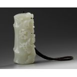 A Chinese white jade 'prunus and bamboo' carving