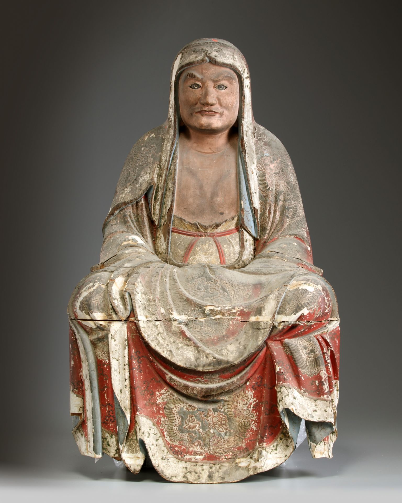A Japanese wooden figure of Daruma