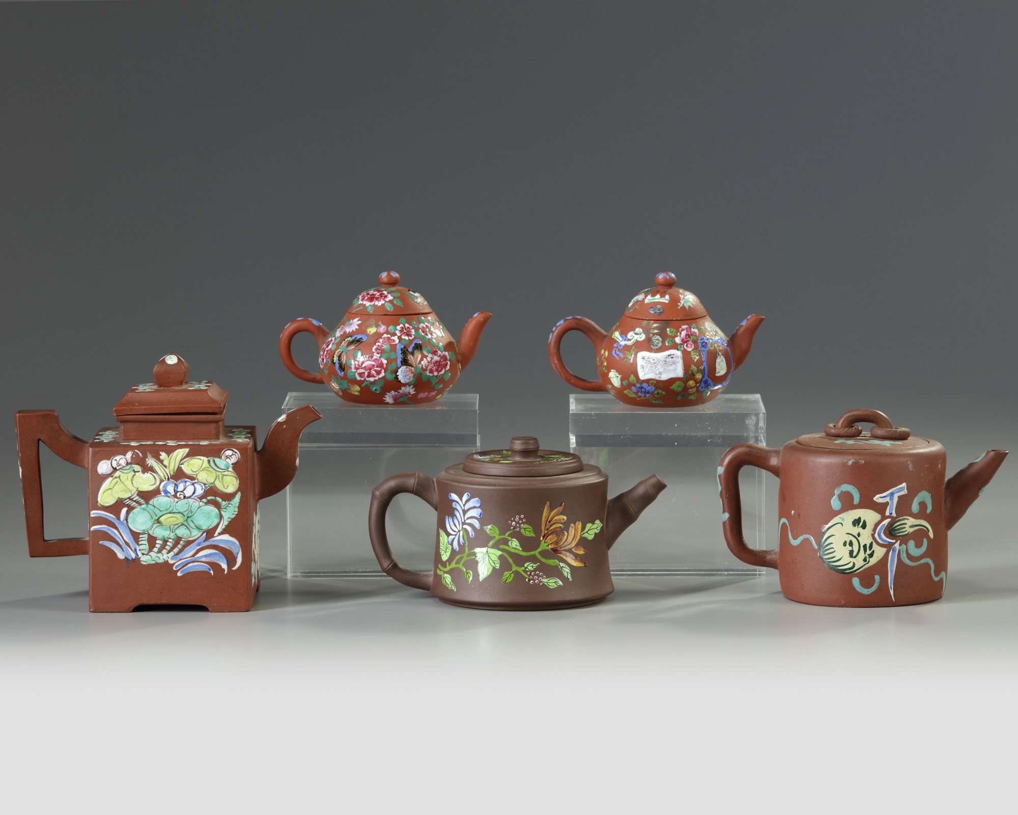 A group of five Chinese enamelled Yixing teapots