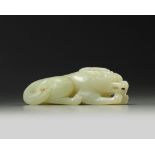 A Chinese pale celadon jade recumbent qilin