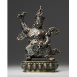 A Tibetan bronze figure of Vajrapani with stand