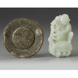 A Chinese celadon jade pommel and a pale celadon jade monkey