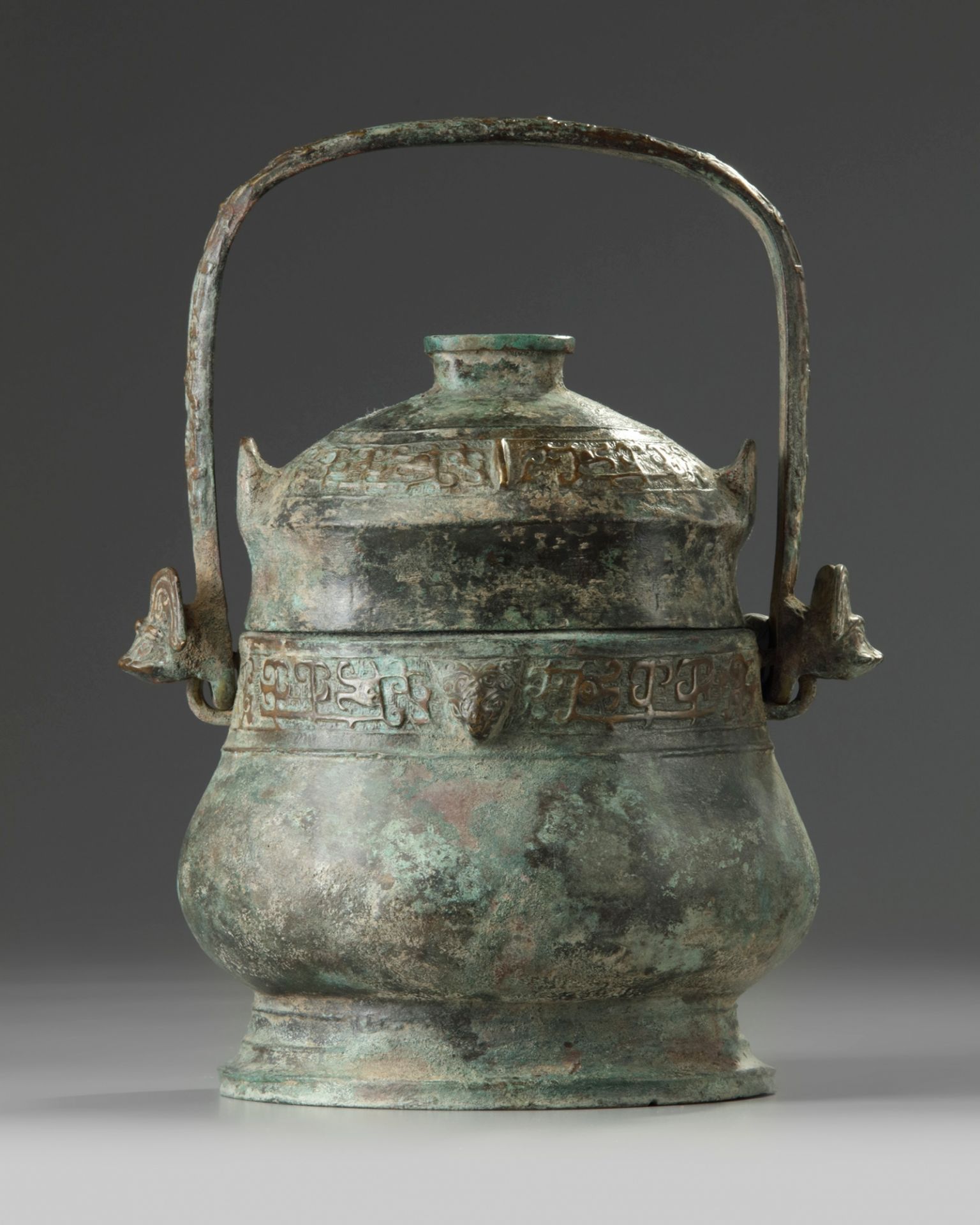 A Chinese bronze ritual wine vessel and cover, you