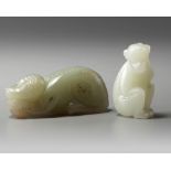 Two Chinese celadon and pale celadon jade monkeys