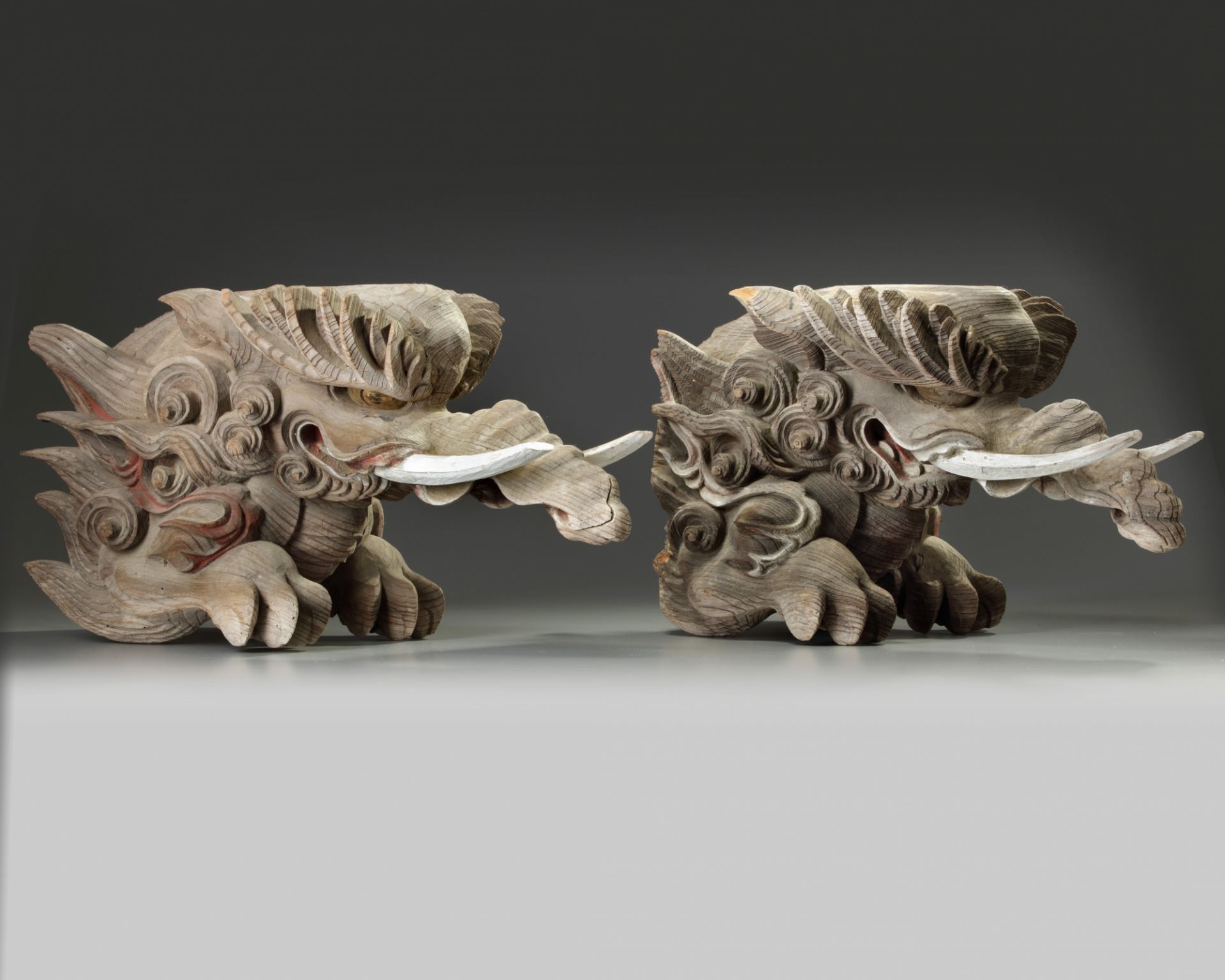 A pair of Japanese carved wood mythical beasts