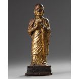 A Chinese gilt-lacquered bronze figure of a monk
